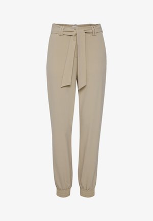 Beige tapered Hosen mit einem gebundenen Gürtel, elastischen Bündchen und glatter Textur. Sie verfügen über zwei seitliche Taschen und einen dezenten Glanz.