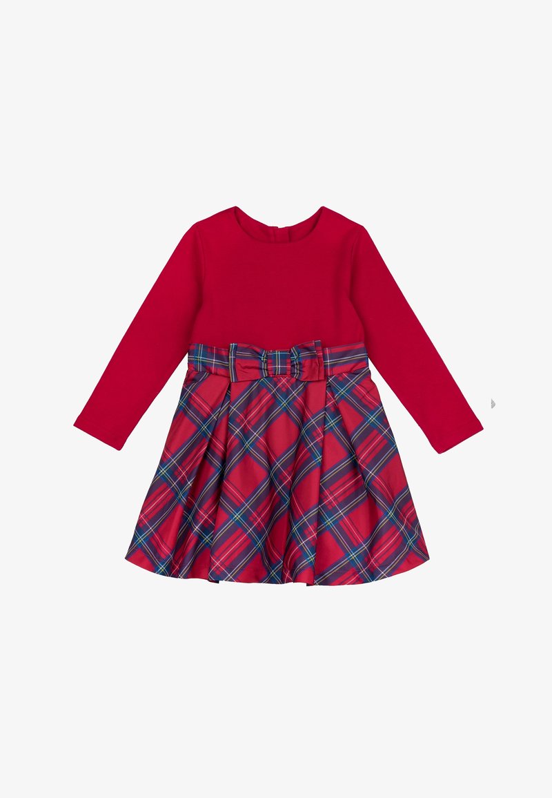 Red long-sleeve dress with a fitted top and a plaid skirt in red, blue, and green, featuring a bow at the waist. Smooth fabric with pleats.