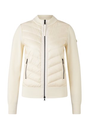 Light cream jacket with a quilted front and ribbed sleeves. Features zippered pockets and a high collar design with a two-way zipper closure.