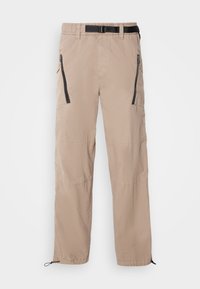 Beige lightweight pants with an elastic waistband and a black belt, featuring zippered pockets and adjustable cuffs. Smooth fabric texture.