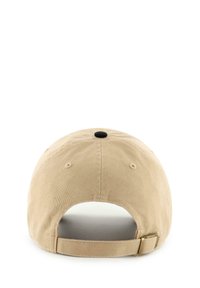 Tan cotton baseball cap with a curved brim, adjustable strap, textured fabric, and a single black vent hole on the top.
