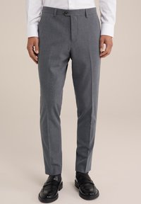 Gray dress pants with a flat front, made from a fine-textured fabric. Features a single button closure and belt loops, styled with black loafers.