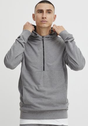 Grijze hooded sweatshirt met een halve rits, gestructureerde stof, kangoeroezak en trekkoorden in de capuchon. Eenvoudige en functionele stijl.