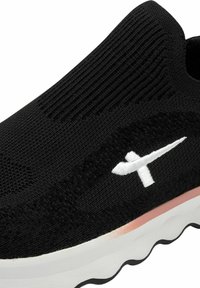 Black slip-on sneaker with a knitted upper, white logo, cushioned white sole, and textured fabric detailing.