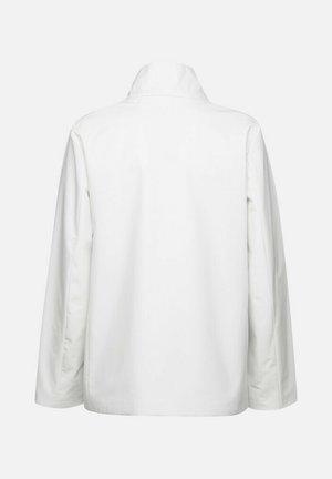 Giacca bianca a maniche lunghe con colletto alto, dalla texture liscia e dal taglio dritto. Nessun hardware o motivo visibile sul retro.