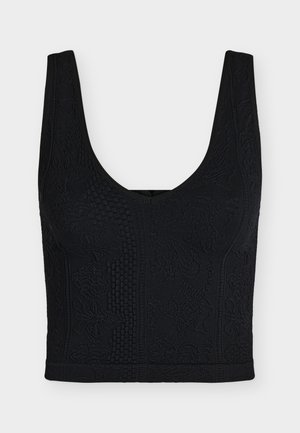 Μαύρο υφασμάτινο cropped top χωρίς μανίκια με φαρδιές τιράντες και διακριτικά λουλουδένια και γεωμετρικά σχέδια στο ύφασμα.