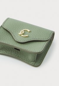 Green leather wallet with a textured finish, curved flap, and gold hardware accent. Compact design with visible stitching detail.