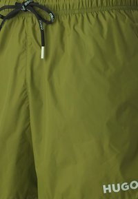 HUGO HAITI - Swimming shorts - open green