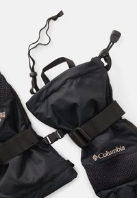 Czarne ocieplane rękawice z teksturowanym uchwytem, regulowanymi paskami i logo Columbia. Posiadają ściągacz do dopasowania.