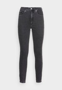 Svarta högmidjade slim fit-jeans i denim. Har klassisk femfickorsdesign och metallknappstängning. Slät textur.