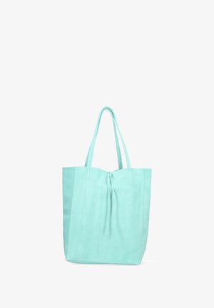Sac fourre-tout vert menthe avec une texture douce, doté de deux longues poignées et d'une fermeture à cordon en haut. Design simple et sans ornements.