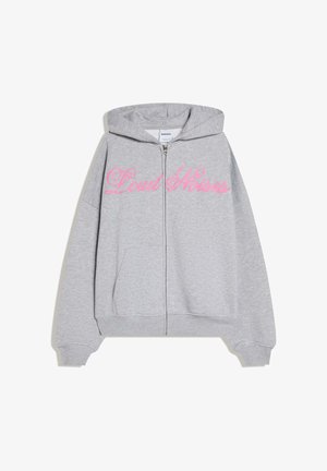 Light gray zip-up hoodie with hood, front pockets, and pink cursive "Loud Noises" text across the chest.