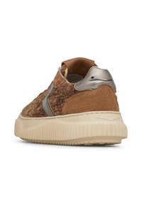 Brown suede sneaker with a textured upper, silver accents, and a cream rubber sole. Features a rounded back with minimal detailing.