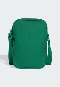 Zöld, texturált anyagból készült téglalap alakú táska, cipzáras záródással és állítható vállpánttal a könnyű hordozás érdekében.