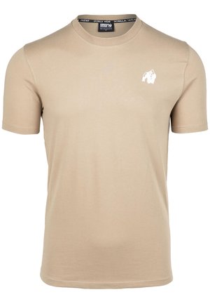 T-shirt beige a maniche corte realizzato in morbido cotone, con un piccolo logo di gorilla bianco sul lato sinistro del petto. Design classico a girocollo.