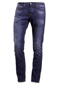 Slim-fit mörkblå denimjeans med framfickor, bälteshällor och urtvättad detaljering på låren och knäna.
