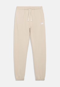 Beige sweatpants with an elastic waistband, adjustable drawstring, and elastic cuffs. Features a white logo on the left thigh. Soft texture.