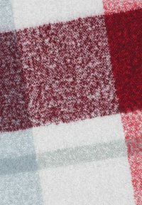 Red and white checkered blanket with a soft, fuzzy texture. Features large squares in varying shades of red and white, with a light gray accent.