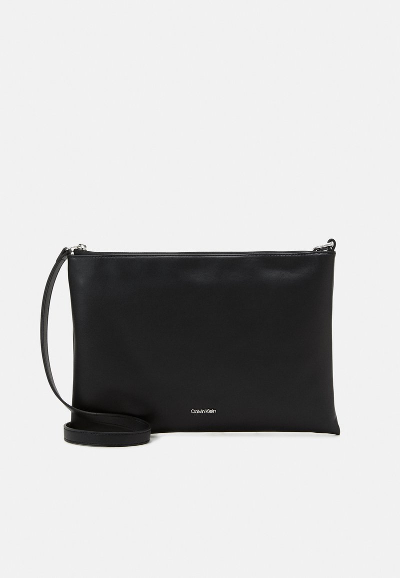 Calvin Klein SOFT POUCH STRAP Handbag black Zalando.co.uk