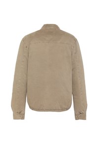Beige Cord-Jacke mit Kragen, langen Ärmeln und Druckknopfmanschetten. Merkmale eine glatte, strukturierte Oberfläche und genähte Nähte.