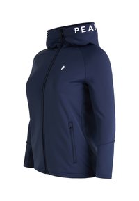 Marineblå zip-up jakke med høj krave, lavet af glat stof. Har hvidt logo og tekst på kraven samt to sidelommer med lynlås.