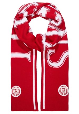 Red and white knitted scarf with large white letters and two circular TJ logos at each end.