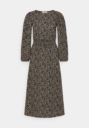 Robe midi noire à manches longues, taille élastique, avec un petit motif floral rose, jaune et vert sur toute la surface.
