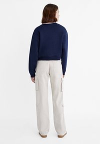 Stradivarius ADJUSTABLE WAIST - Hlačami s stranskimi žepi - beige