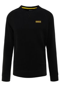 Black sweatshirt with long sleeves, round neck, and a yellow logo patch on the chest. Soft texture with ribbed cuffs and hem.