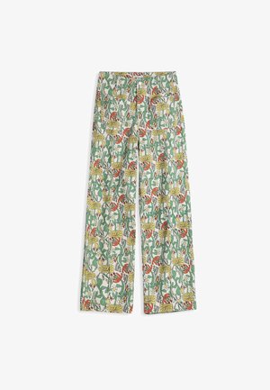 Pantalon à jambes larges avec un motif floral multicolore mettant en vedette des tiges vertes, des fleurs jaunes, rouges et blanches sur un fond blanc.
