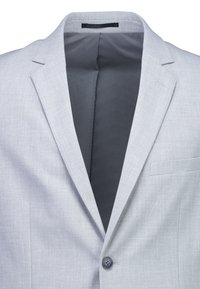 Lichtgrijs herenblazer met inkeping revers, enkele knoopsluiting en donkergrijze voering.