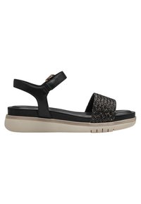 Svart sandal med ett vävt accent, justerbar ankelrem och en ljus färgad plattformssula. Strukturerad tyg och släta läderdetaljer.