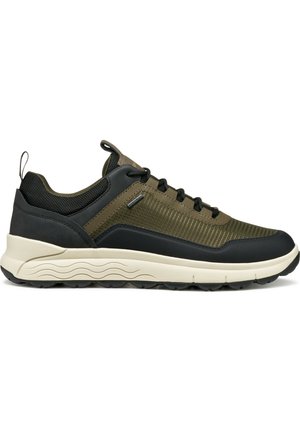 Men's sneaker in olive green and black, featuring a textured fabric upper, lace closure, rubber sole with wave pattern, and pull tab.