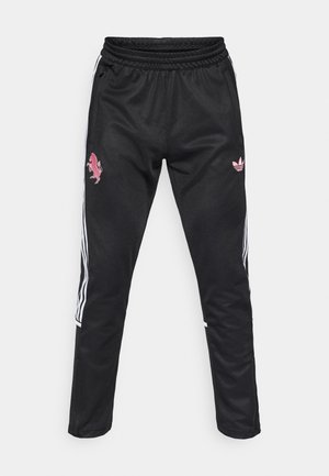 Svarte treningsbukser med teksturert overflate, med rosa brodert logo og mønster, hvite sidestriper og elastisk midjebånd.