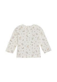 Långärmad topp i krämfärgad tyg med botaniskt och djurtryck i mjuka bruna nyanser, med en volangkrage och knappstängning på baksidan.