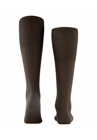 Calze marroni al ginocchio con una texture a coste, dotate di punte rinforzate e una soletta liscia. Progettate per comfort e durata.