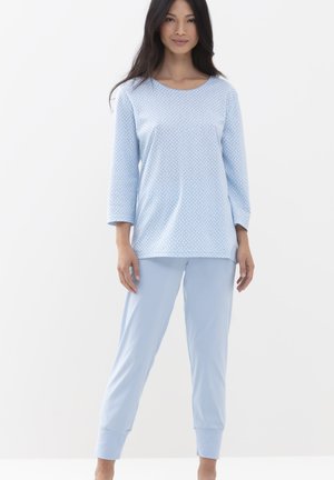 Light blue pajama set featuring a long-sleeve top with a polka-dot pattern and matching pants with cuffed hems. Soft, breathable fabric.
