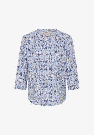 Viegla topiņa zilā un krēmkrāsas ziedu rakstā ar apaļu kaklu un trīs ceturtdaļu garuma piedurknēm. Mīksts, plūstošs audums ar brīvu piegriezumu.