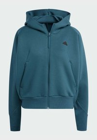 Felpa zip con cappuccio color teal in un materiale morbido, dotata di tasca a marsupio e cappuccio con cordino. Presenta un piccolo logo nero sul lato sinistro superiore.
