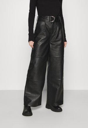 POPPY PANTS - Leather trousers - black