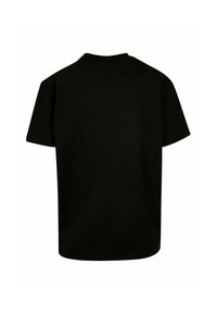 T-shirt noir à manches courtes en coton solide, avec un col rond classique et une coupe décontractée. Aucune motif ni graphique visible.