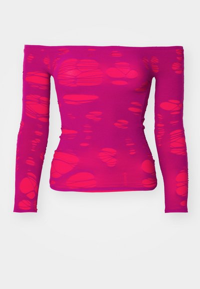 Off-shoulder, long-sleeve magenta top with a pattern of irregular, translucent cut-out shapes throughout the fabric.