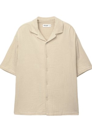 Short-sleeve button-up shirt in light beige, with a textured, crinkled fabric and a camp collar design. Features six buttons down the front.