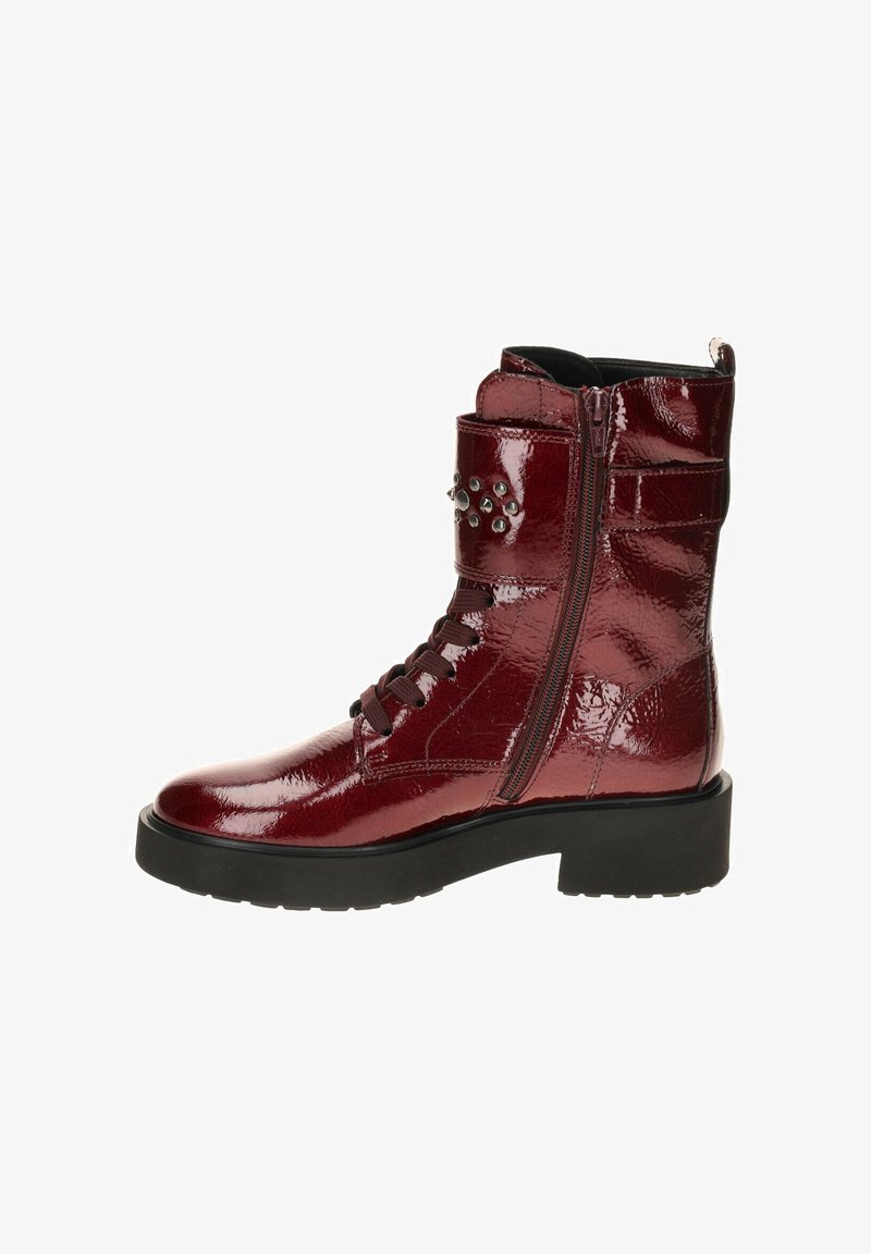Burgundy patent leather ankle boots with a front zipper, lace-up design, studded detail on the cuff, and a chunky black sole.