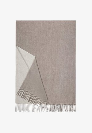 Woven blanket in light beige and taupe with fringed edges, showcasing a soft texture and a reversible design for versatile use.