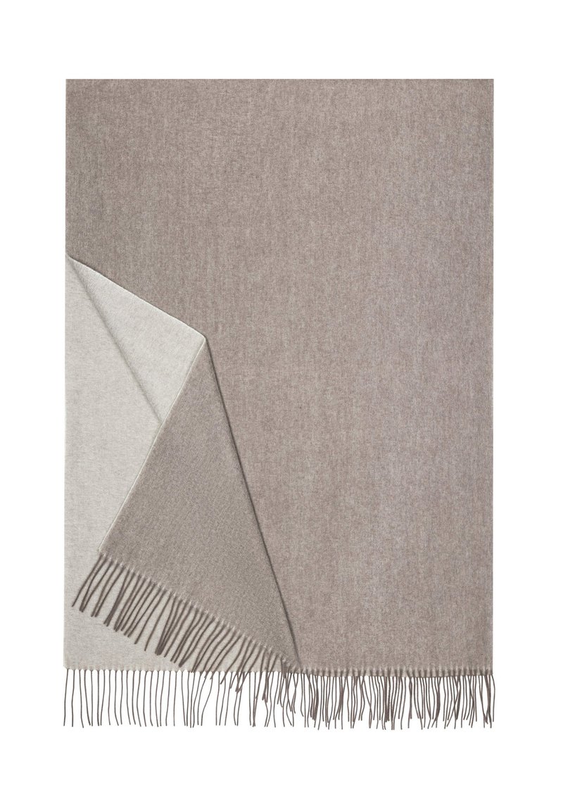 Woven blanket in light beige and taupe with fringed edges, showcasing a soft texture and a reversible design for versatile use.