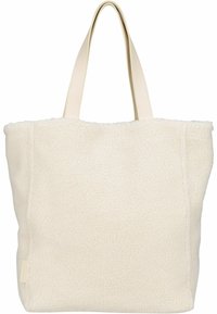 Kremowa torba typu tote o puszystej fakturze, miękkim materiale i gładkich, kontrastowych skórzanych uchwytach. Prostokątny kształt z przeszyciami.