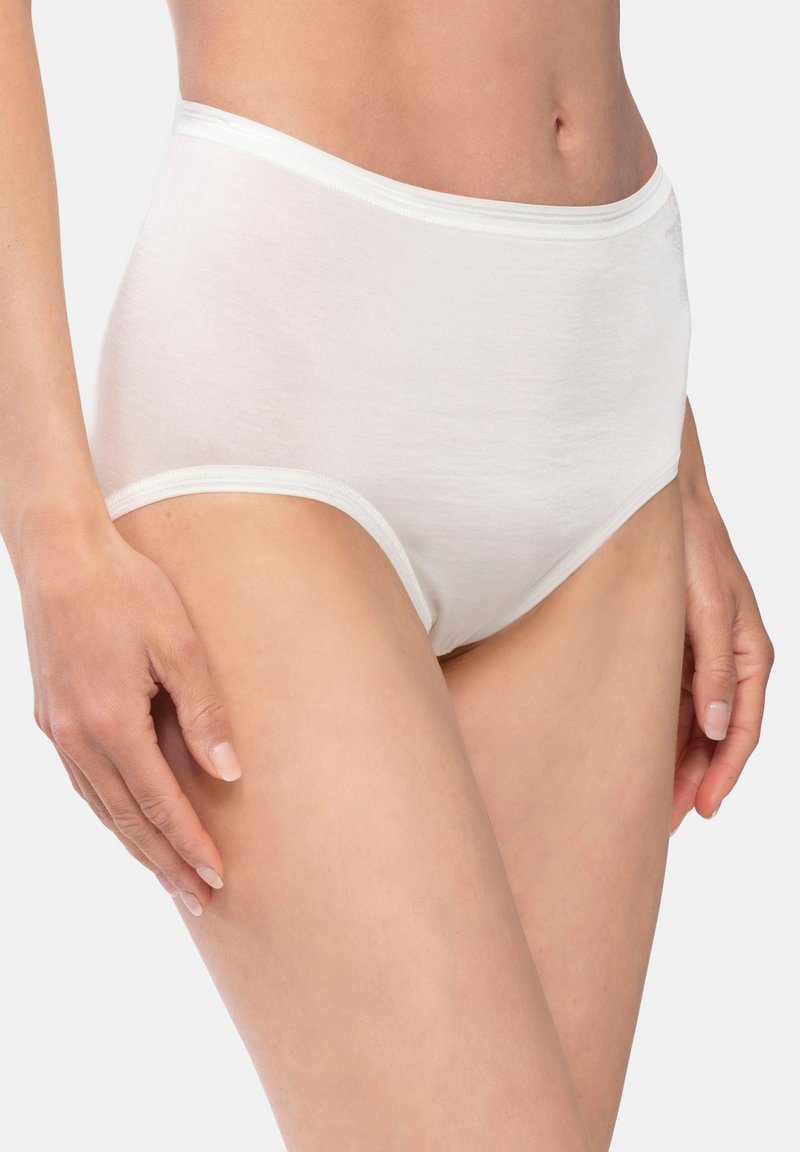 White cotton high-waisted underwear with a seamless design, soft texture, and a smooth elastic waistband, shown on a light skin tone.