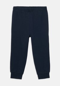 Tamno plave hlače za jogging s elastičnim pojasom i rebrastim manžetama, položene ravno na bijeloj pozadini.