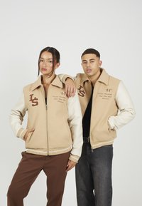 LEGACY STUDIOS BUZZ UNISEX - Bomber Jacket - cream
